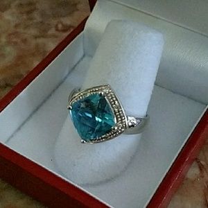 Blue topaz ring with diamonds